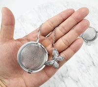 Tea infuser with insect charms